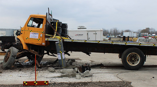 An ultra-shallow bollard after being hit by a truck